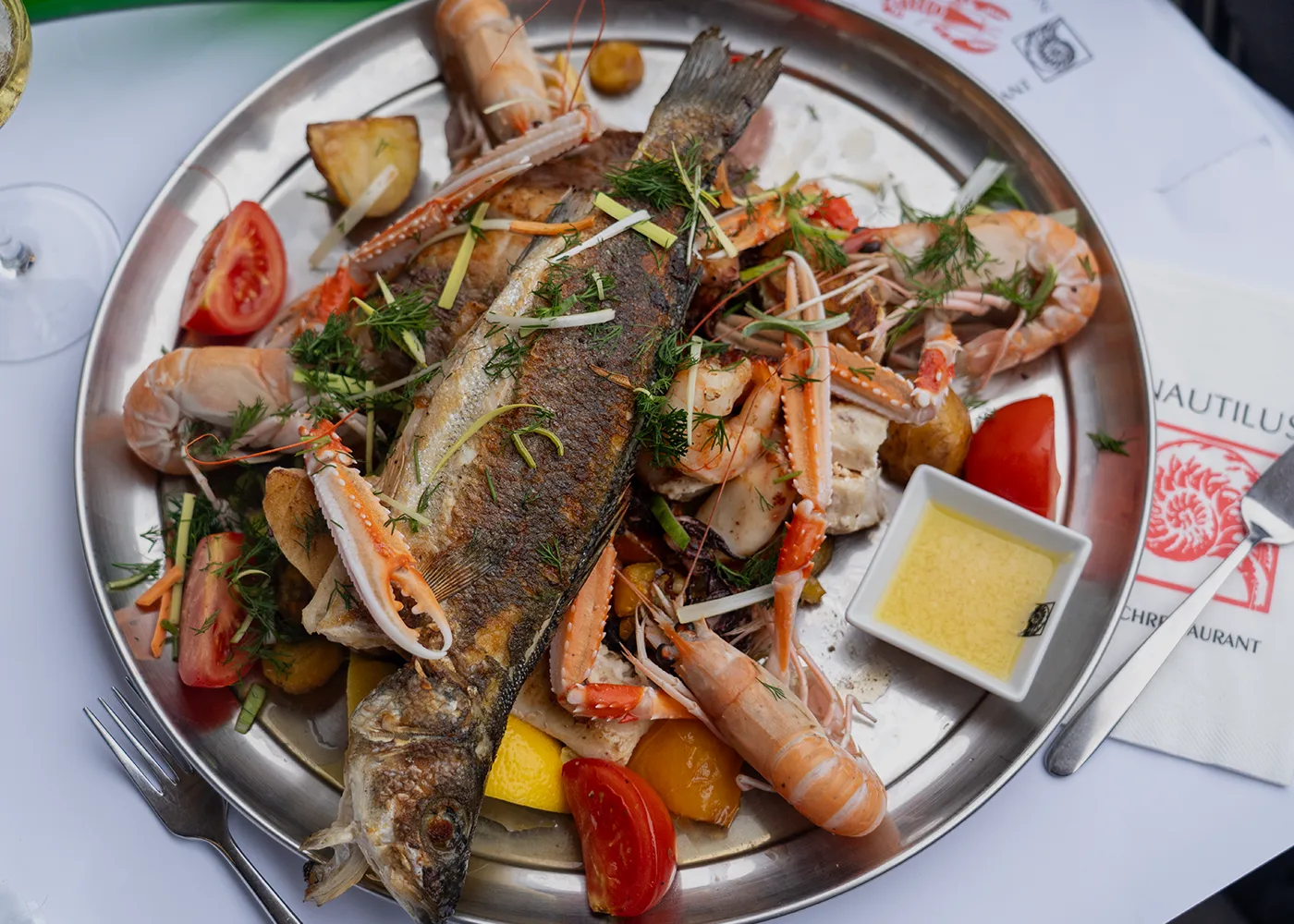 Nautilus fish platter with whole fish and scampi