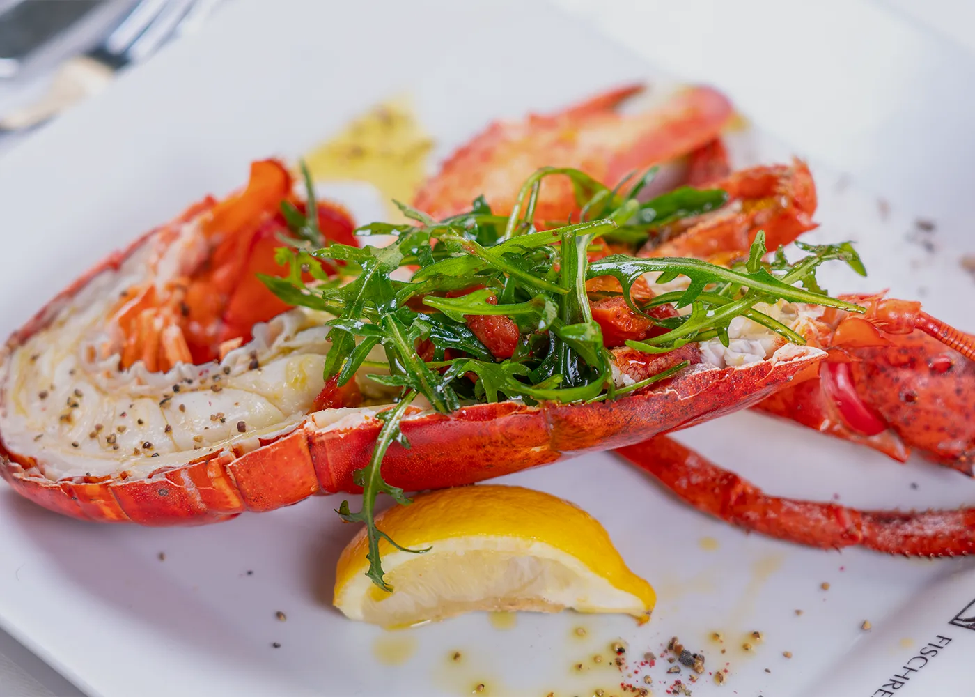Grilled lobster with rocket and lemon